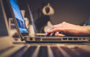person typing on keyboard