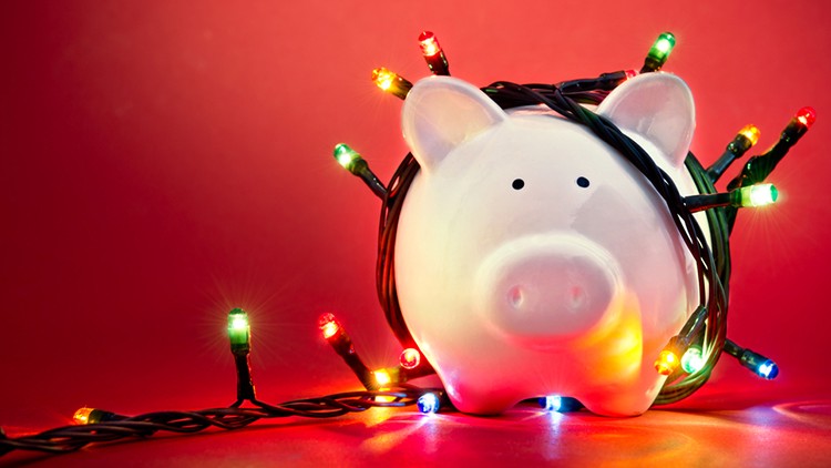 piggy bank draped with christmas lights