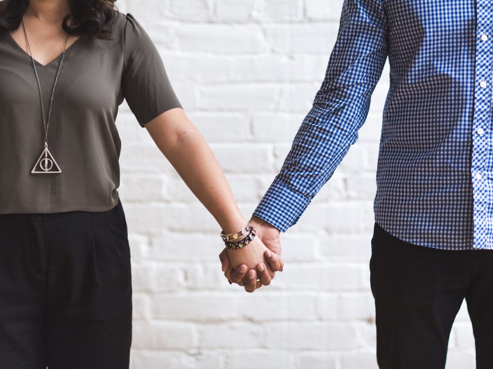 Couple holding hands