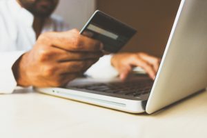 guy using credit card to buy online
