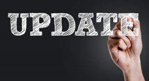 Hand writing the text: Update