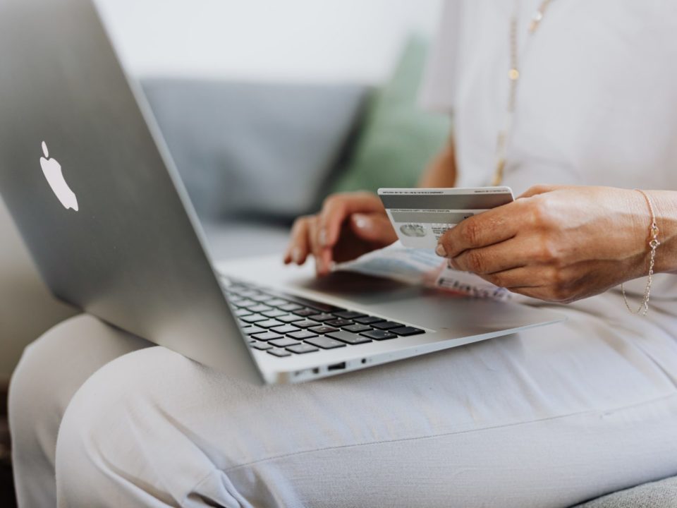 Women sitting with laptop and credit card